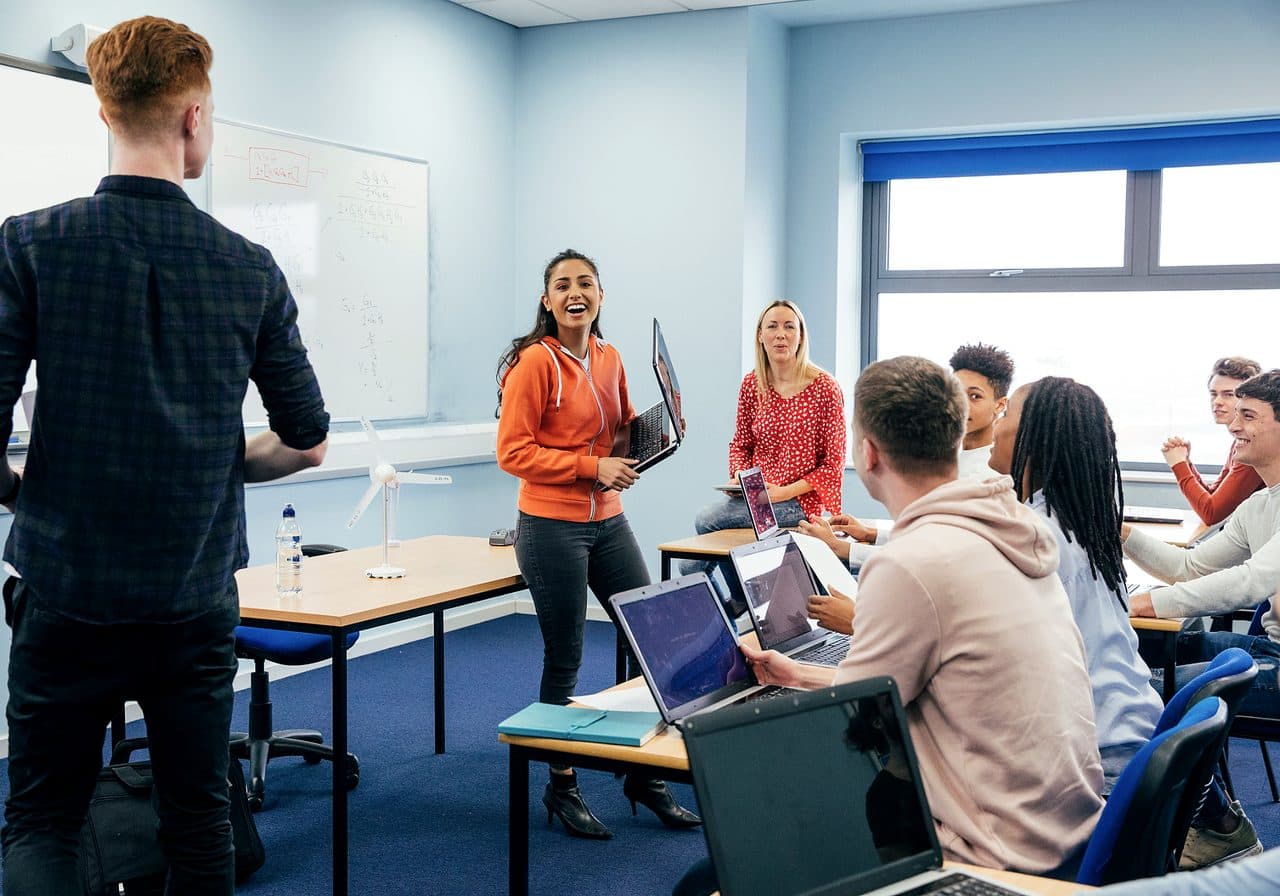 Students participating in hands-on career and technical education with an instructor