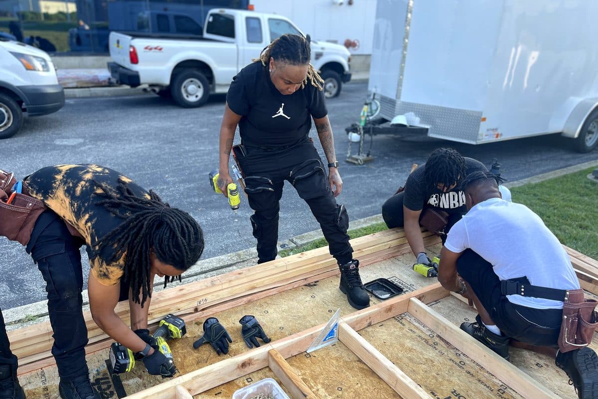 IWOWS trainees building a tiny home together on a real job site